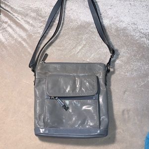Light blue leather purse with synthetic details